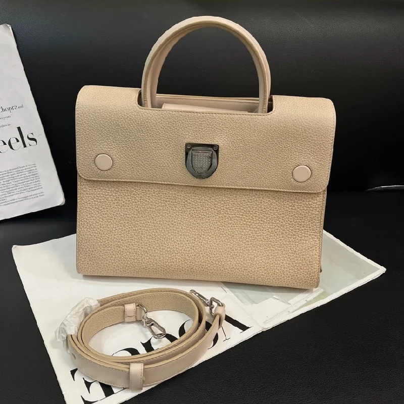 Christian Dior Saddle bags with a patent leather finish for a shiny lookDior Beige Leather Handbag 30cm