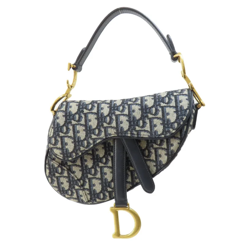 Christian Dior handbags with a snap - button closure and a decorative buckleDior Saddle Handbag