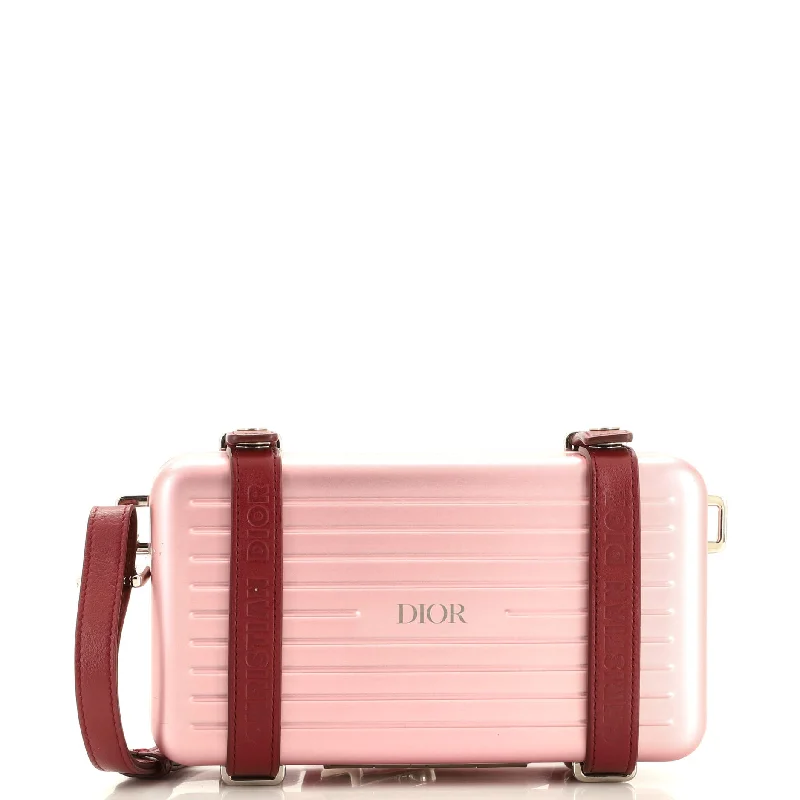 Christian Dior backpacks with a sleek, minimalist silhouetteDior x Rimowa Personal Clutch Aluminum