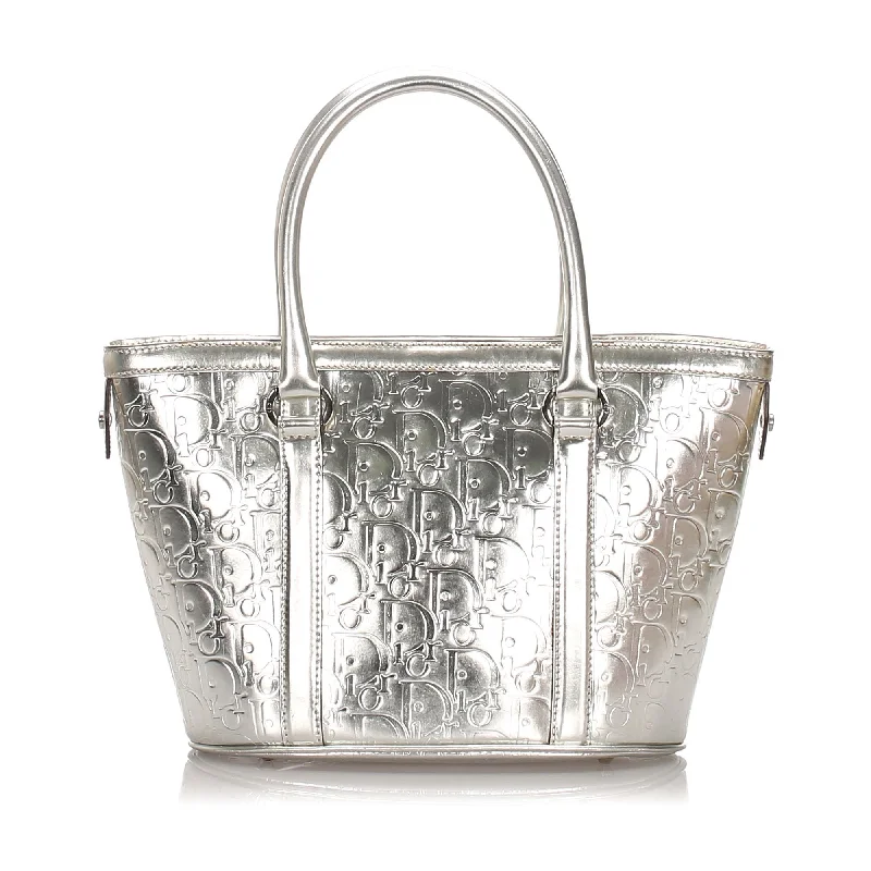 Christian Dior bags with a side - pocket for holding a water bottlePre-Loved Dior Silver Patent Leather Oblique Tote Bag Italy